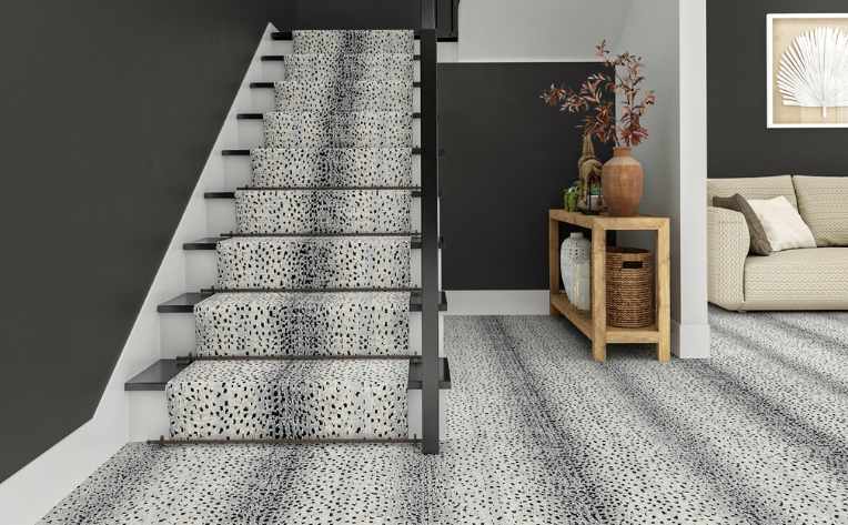 modern patterned carpet on entryway staircase with dark gray walls