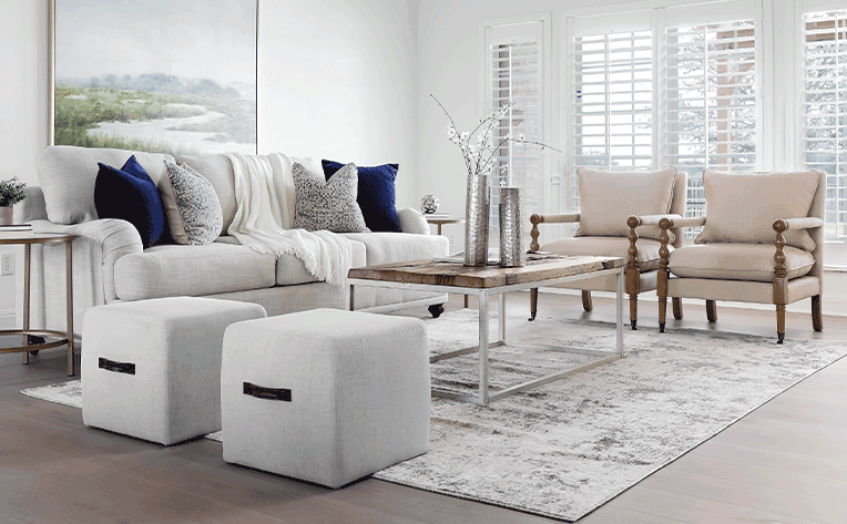 living room with cozy layers and area rug for transitioning from summer to fall