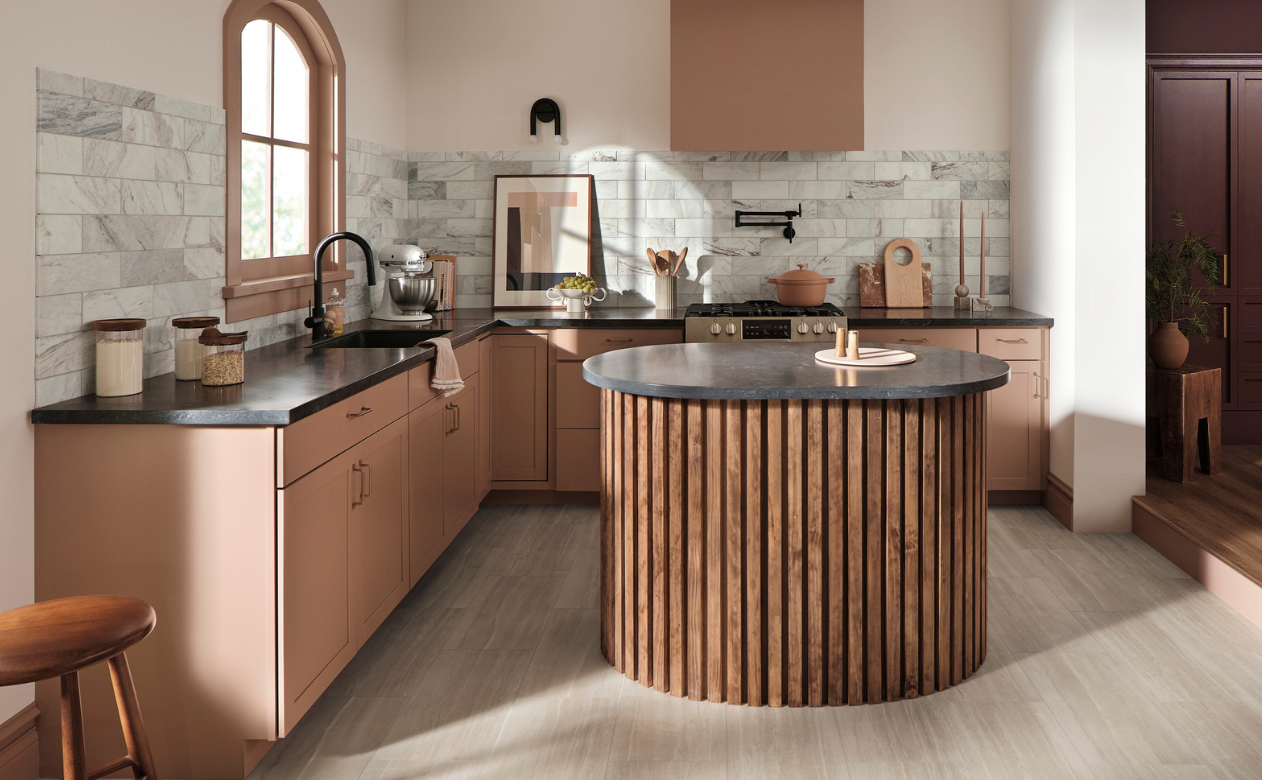 black countertops in a kitchen with terracotta cabinets