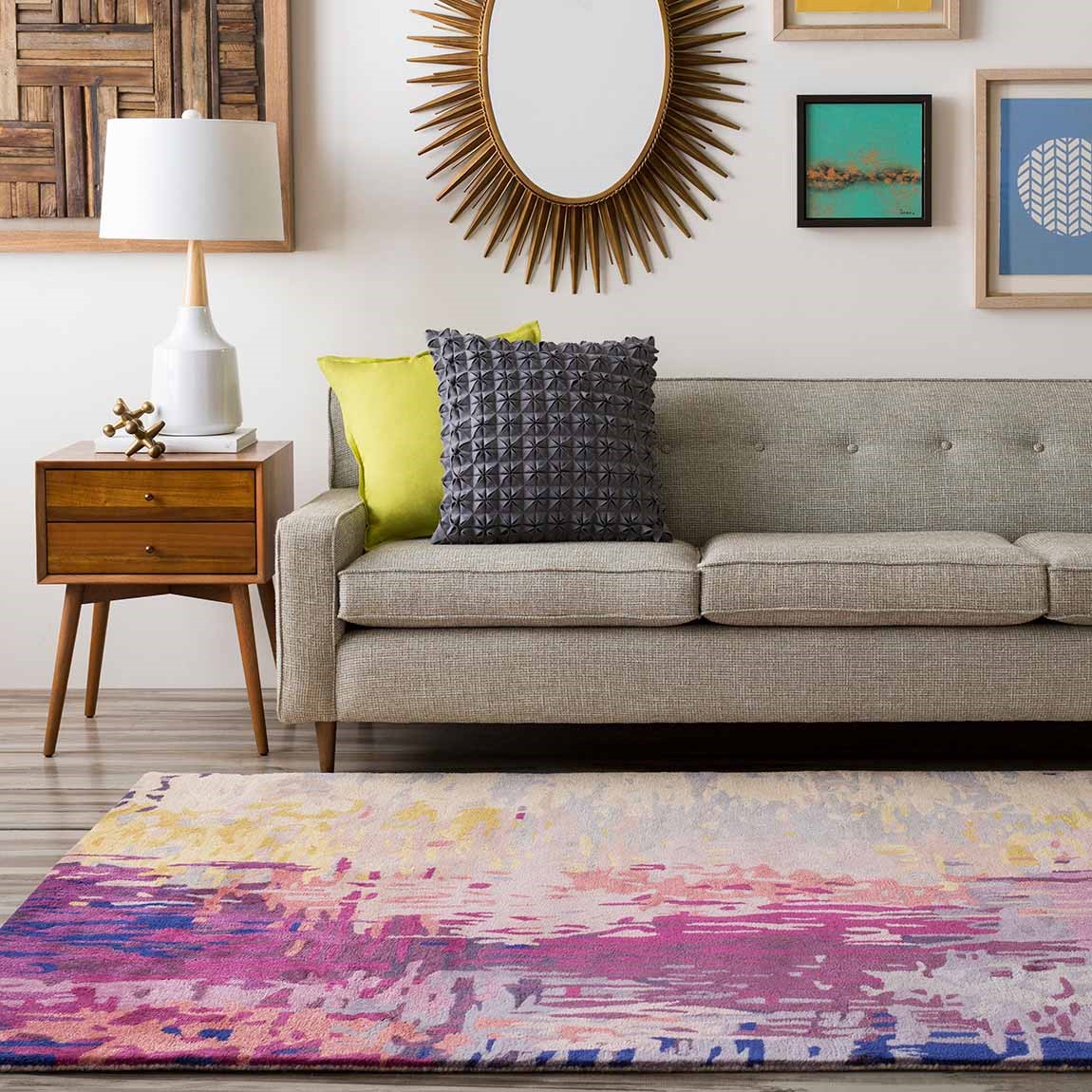 living room couch and side table with gallery style walls