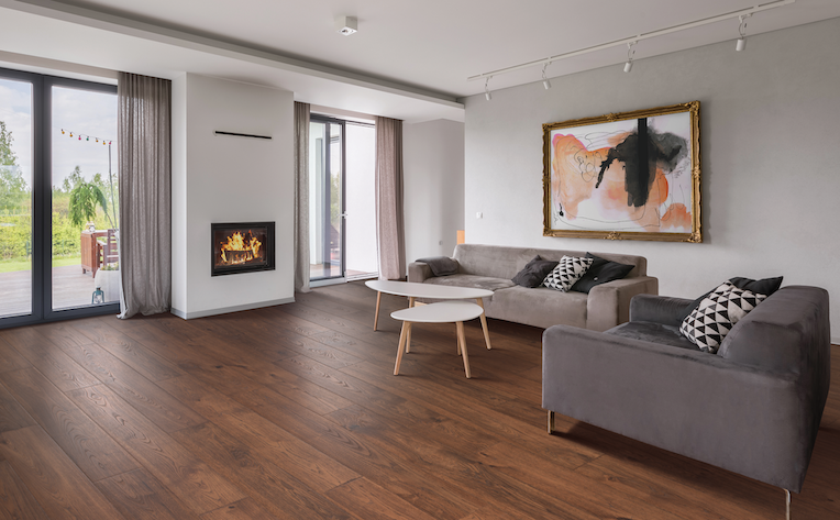 dark toned wood look laminate flooring in a modern minimalist living room with fireplace